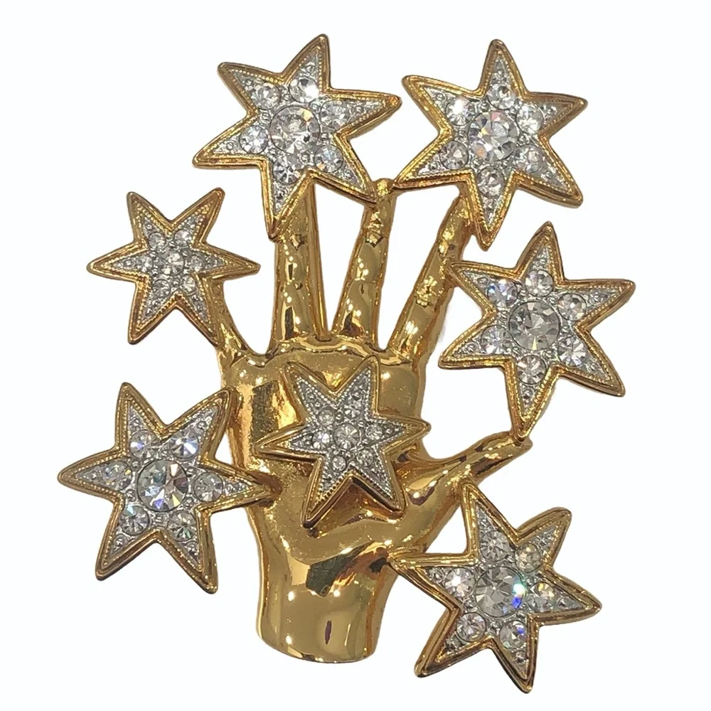 NOLAN MILLER SHINY GOLDEN HAND WITH CRYSTAL STARS BROOCH